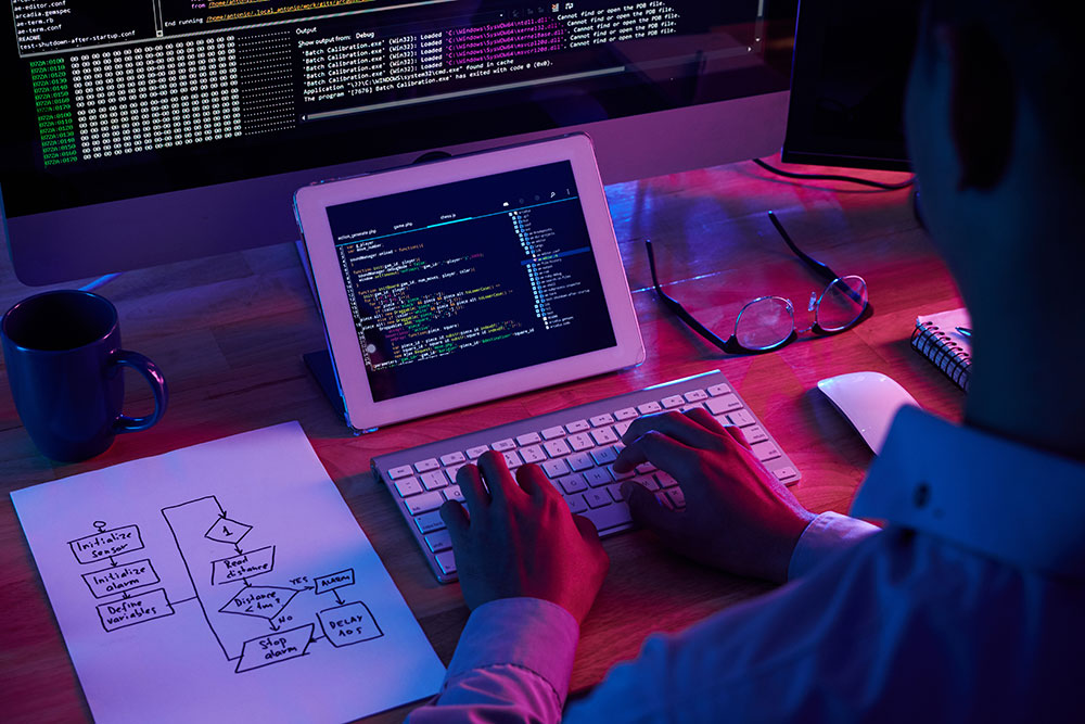 professional programmer working late dark office